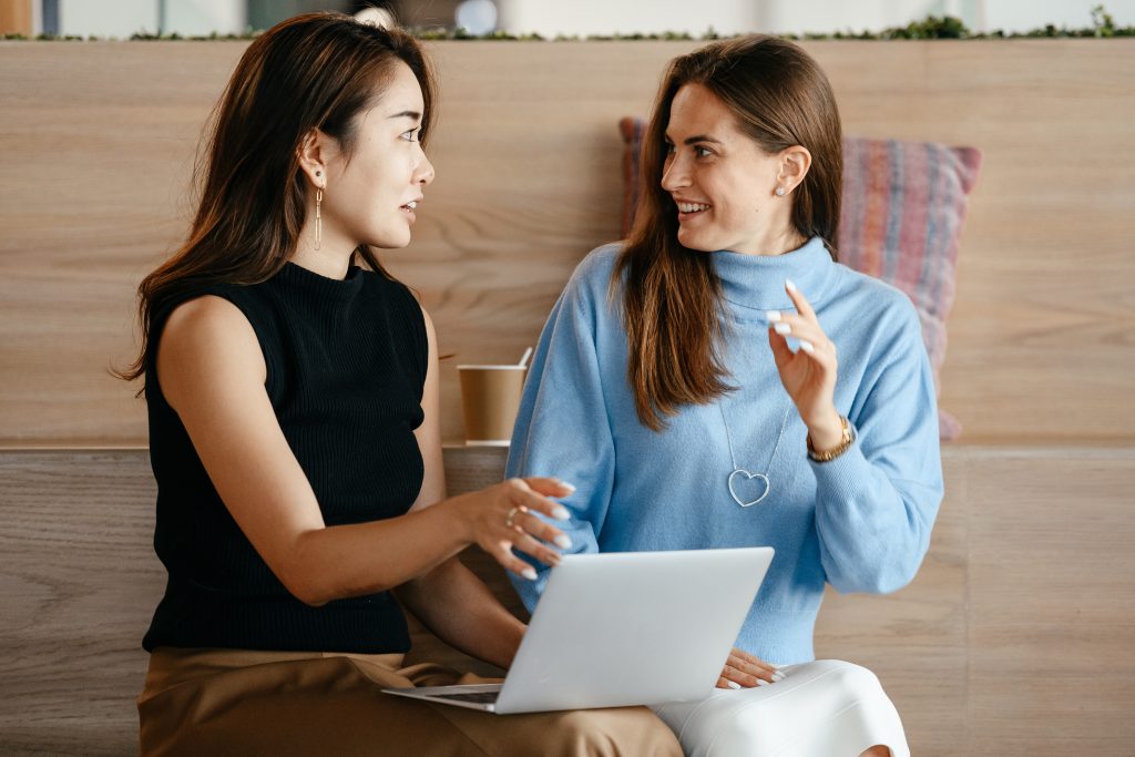 Two accountants happily talking to each other