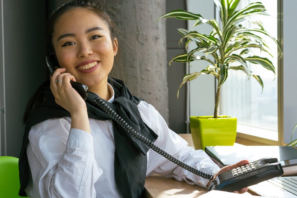 accountant happily taking a clients phone call