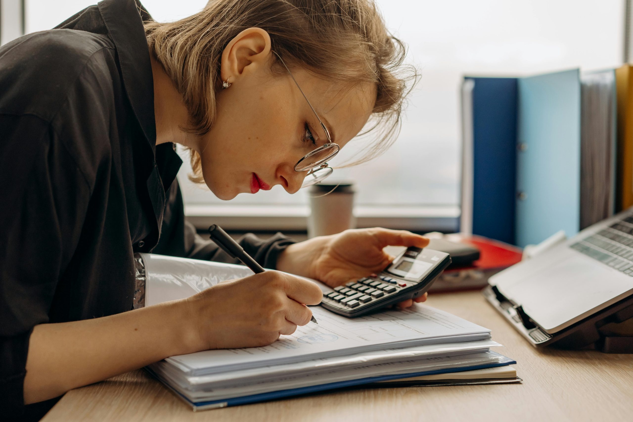 female accountant computing tax return