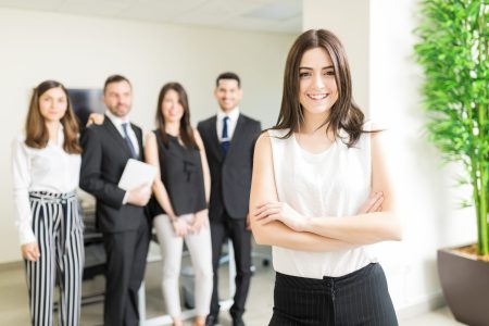 Positive female business tycoon smiling while leading organization
